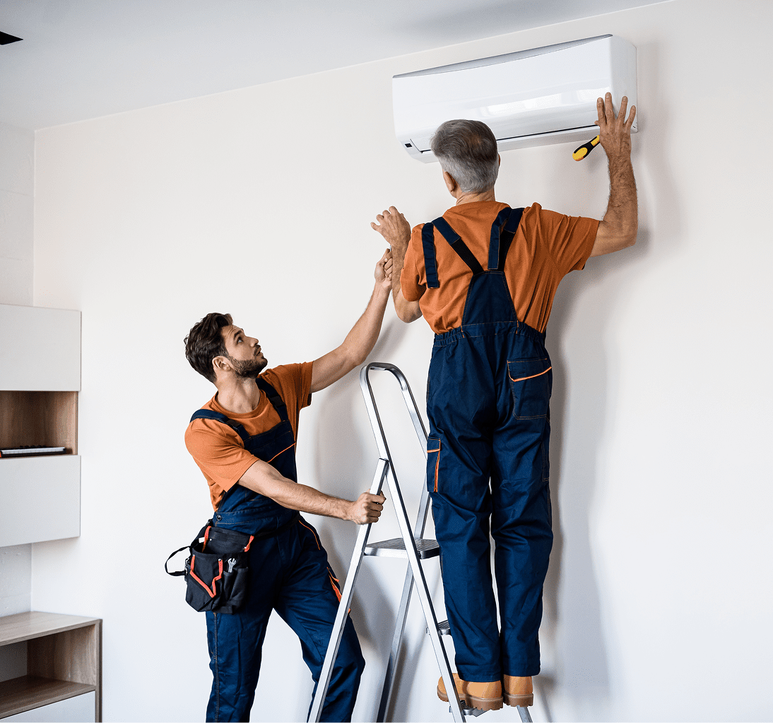 Two men repairing home air conditioner